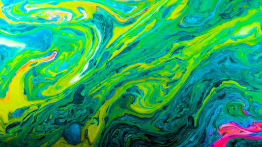 绿色迷幻抽象明亮的颜色混合在液体中