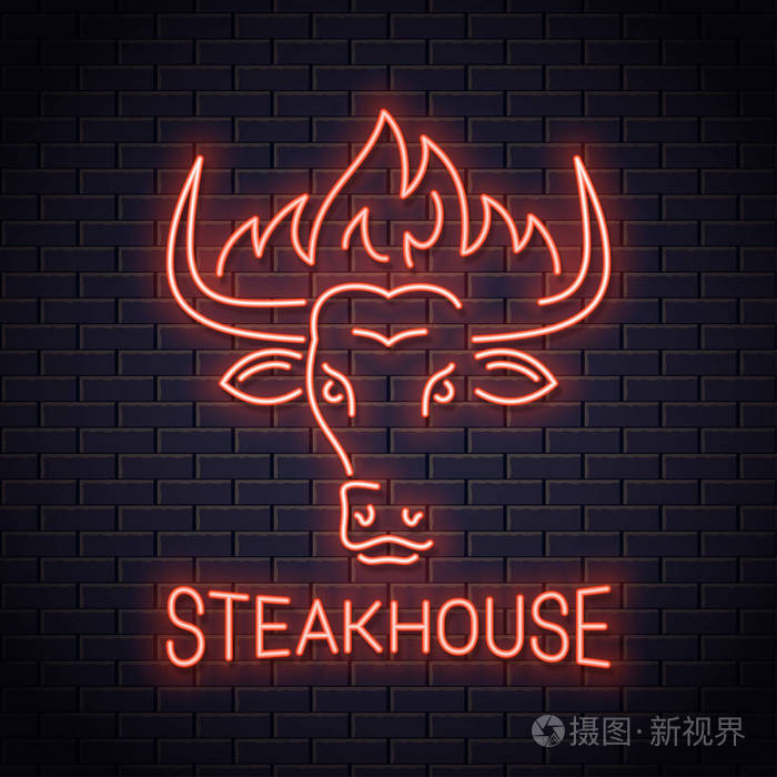 牛头霓虹灯牛排屋的标志.与火的公牛