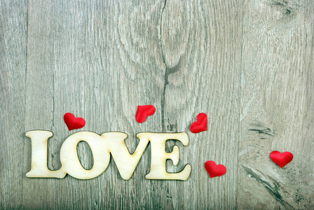 s Day. Hearts  a symbol of love. Hearts on a wooden background.