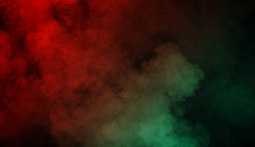 抽象的红色和绿色的烟雾蒸汽在黑色背景上移动。 芳香疗法的概念