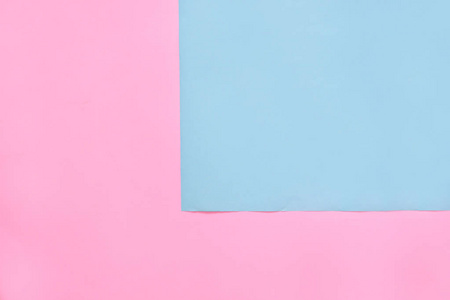 美丽的粉红色和蓝色粉彩纸纹理空平。 趋势可爱的颜色，最小的图案或背景概念。 抽象淡蓝色和粉红色的软纸背景与顶部视图复制空间。