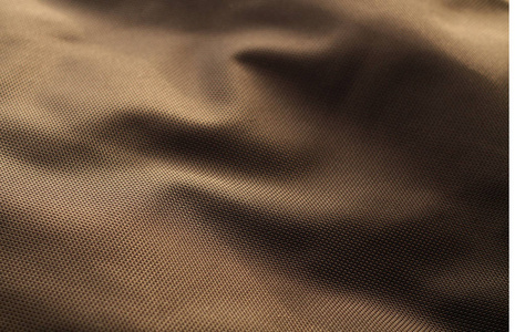 棕色纺织纹理与模糊效果。 设计的抽象背景和纹理。