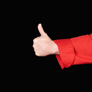 s hand in  red uniform shows a gesture of approval, like, black 