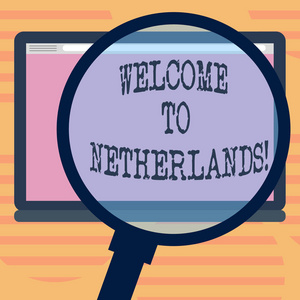 文字书写文本欢迎来到荷兰。致荷兰放大平板电脑空白彩色屏幕照片文本空间的游客的温馨问候的商业理念