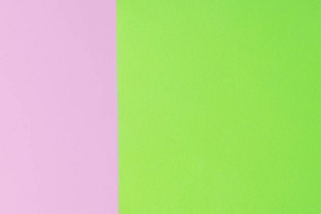 柔和的粉红色和绿色的纸作为纹理背景。平躺着。最小的概念。创意理念。流行艺术。明亮甜美的时尚风格