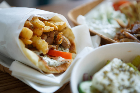  gyros meat sandwich dish from Greece served in paper plate.Tast