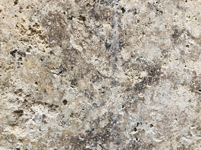 花岗岩背景的纹理。 花岗岩纹理白色基部有棕色灰色斑点。