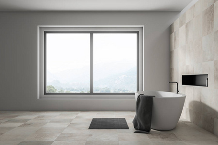 侧观时尚的浴室，白色和米色瓷砖墙，大窗户，白色浴缸，上面有灰色毛巾和灰色地毯。3D渲染
