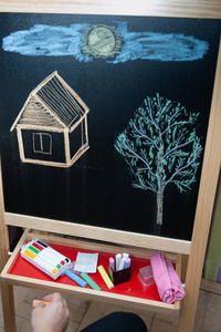 s drawing, a house and a tree, the concept of creativity with co