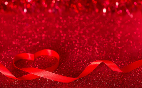 s day. Bright shiny red background with ribbon