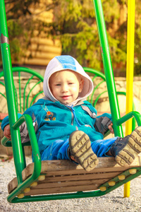 s entertainment complex with swing, sandbox, carousel and slides