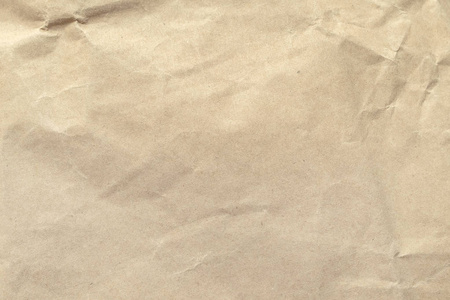 棕色皱褶的纸质地作为背景。