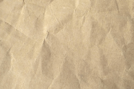棕色皱褶的纸质地作为背景。