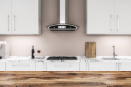 白色厨房台面，内置炊具和水槽和白色橱柜以上，位于厨房与米色墙壁。 前景中的木制桌子。 3D渲染模糊