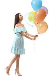年轻漂亮的女人带着白色背景的气球