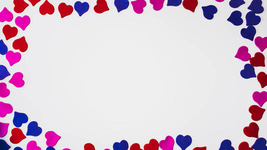 s day background. Colored little hearts on a white background. C