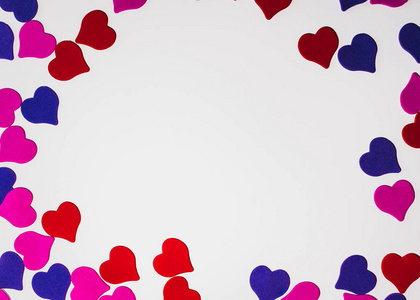 s day background. Colored little hearts on a white background. C