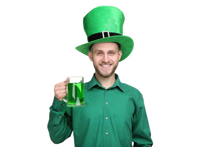 s Day. Young man wearing green hat with glass of beer on white b