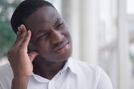  ill african man suffers from headache, vertigo, dizziness, migr