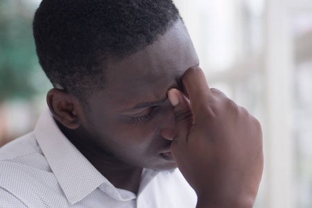  ill african man suffers from headache, vertigo, dizziness, migr