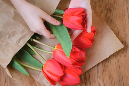 s hands. Spring flowers. 