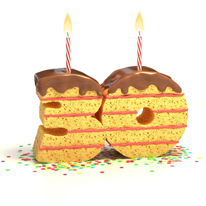 五彩纸屑点燃蜡烛的三十岁生日或周年纪念庆祝与被包围的巧克力生日蛋糕