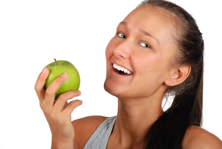 年轻人微笑美丽妇女与绿色苹果 portret