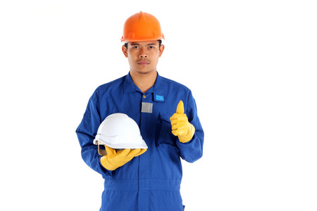 亚洲工人与施工安全头盔概念