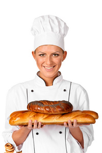 可爱的女厨师贝克或厨师拿一个美丽大面包布雷亚