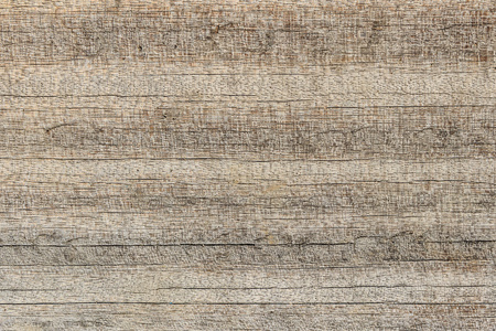 风化木材纹理背景显示裂纹图案，自然的颜色