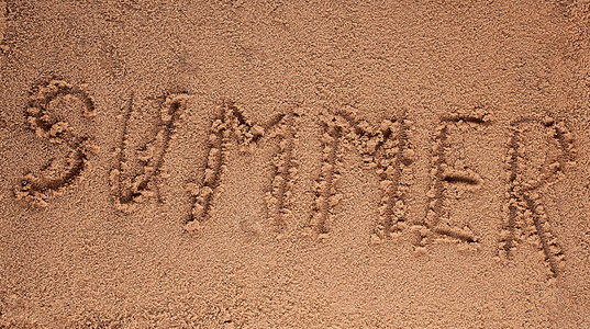 写在沙滩上绘图的阳光与海滩上的 word 夏天