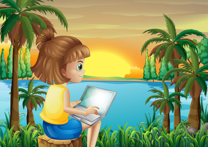一个女孩在河边用她的笔记本电脑