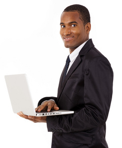 快乐非洲商务男人用白色上孤立的笔记本电脑