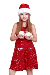 小女孩在圣诞老人的帽子上的节日主题