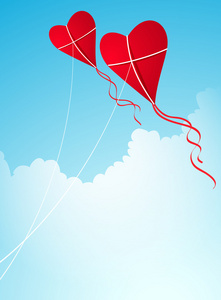 两个红色的心形风筝在天空中