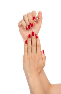 修剪整齐的红指甲的女人手