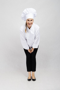 年轻的专业厨师的女人。孤立在白色的背景