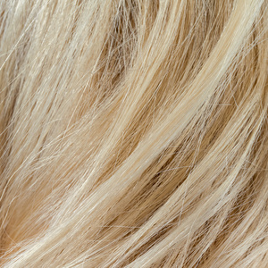 波浪的金发女人头发背景和纹理