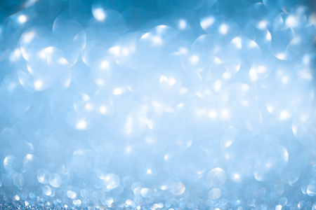 蓝色的焦散景灯下雪圣诞节背景