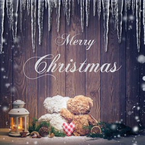 快乐圣诞字幕和环抱的熊图片