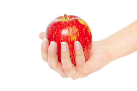 在女性手中的红苹果