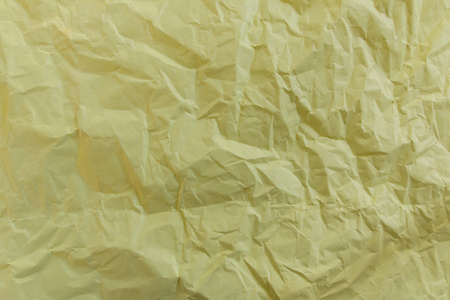 在背景的黄色基调空白弄皱的纸