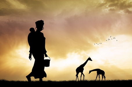 非洲的女人和儿子在日落时