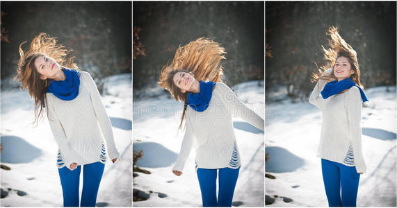 迷人的黑发女孩，穿着白色毛衣，在冬天的风景中摆姿势。 美丽的年轻女人，长发享受雪