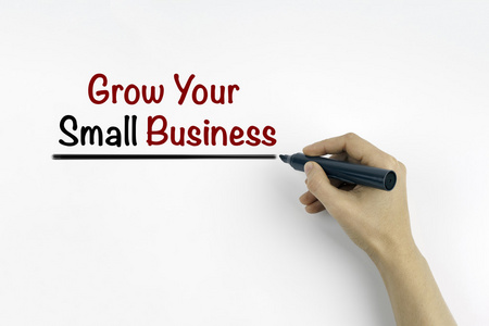 手与书写标记  成长您的小型企业