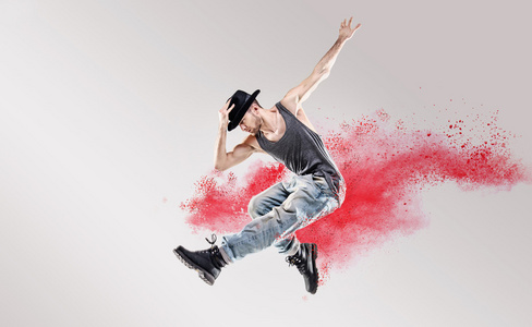 嘻哈舞蹈演员当中的红色尘埃的概念化图片