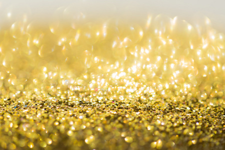 金的背景，抽象的金黄散景轻的庆祝