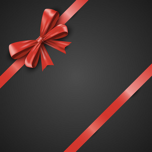 礼物现实的红色蝴蝶结和丝带倾斜在黑色背景上。