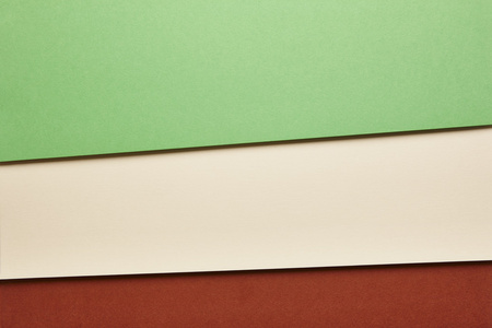 彩色的硬纸板背景在绿色米色红色调。复制 spac