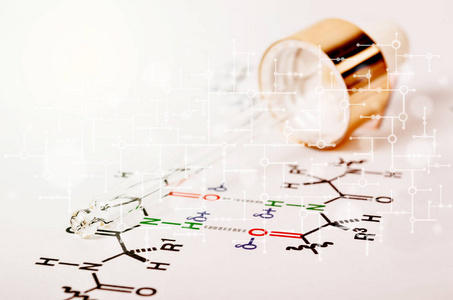 实验室玻璃吸管在化学公式纸上图片